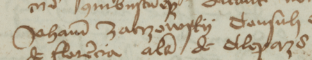 Z księgi ziemskiej krakowskiej obejmującej lata 1457–1463: fragment wpisu z 1458 roku stwierdzającego wydzierżawienie
przez Helenę, wdowę po Tomaszu Pszonce z Więcławic, rajcy Janowi Zakrzowskiemu dziedziny położonej
w tychże Więcławicach – zbliżenie zapisu imienia, urzędu i obywatelstwa
(Archiwum Narodowe w Krakowie, sygn. Terr. Crac. 15, s. 735)